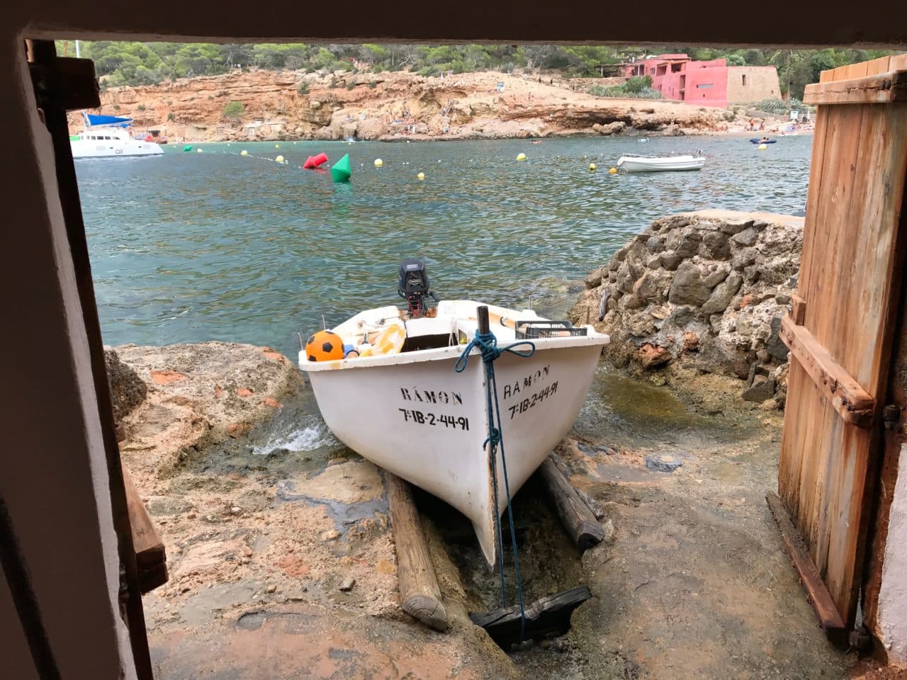 Boat At The Entrence Of A Cave With Doors Open Boat At The Entrence Of A Cave With Doors Open