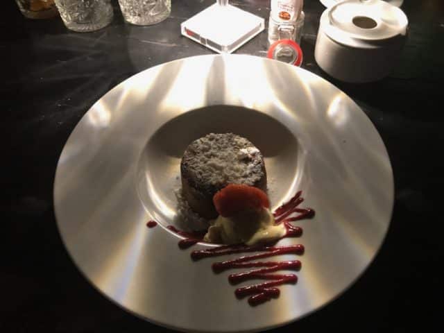 Chocolate Dessert On A Plate With Jam And Strawberries