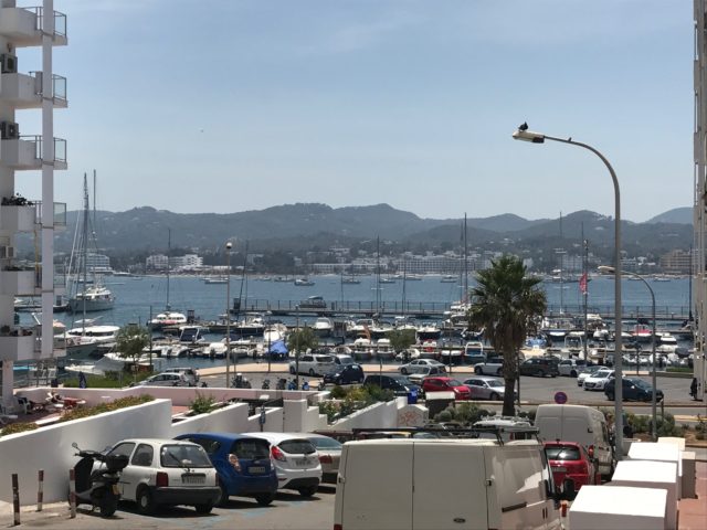 Harbor With Boats And Cars In Front Of It