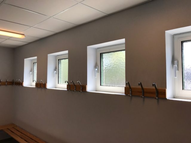 Small Windows In Dressing Room With Coat Hangers