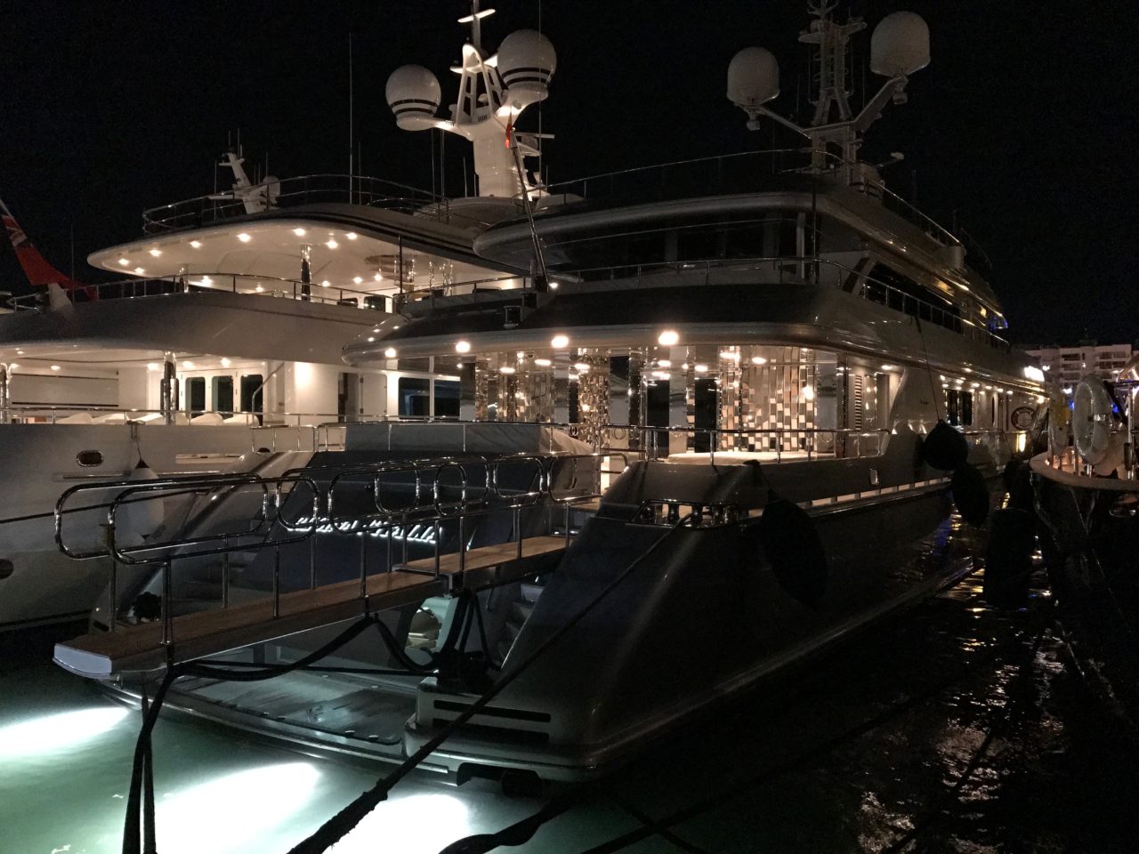 Black Luxury Yacht With Lights By Dock