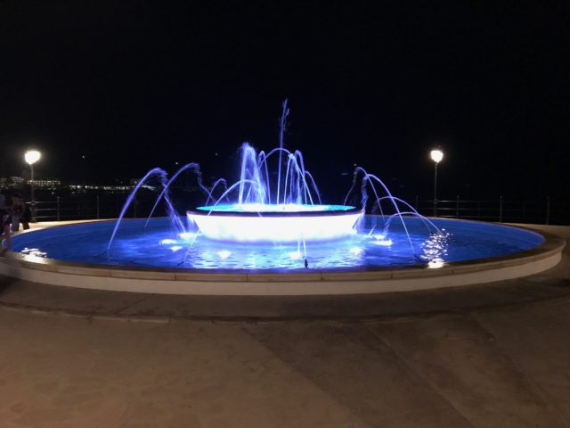 Blue LED Lit Water Fountain At Night
