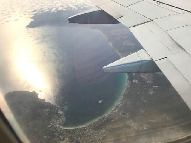 Airplane Window View Of Ibiza Coastal Line