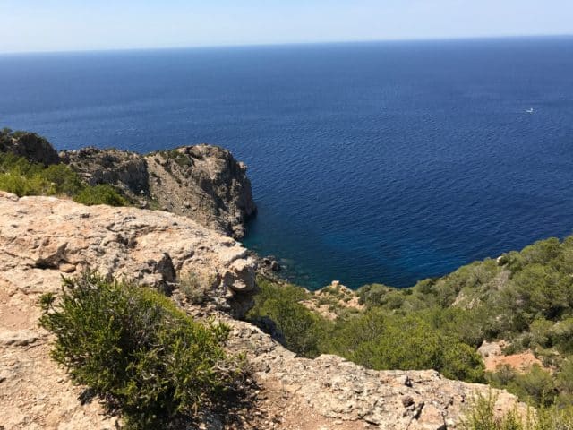 View Of An Ocean Cove From On Top Of A Cliff Side