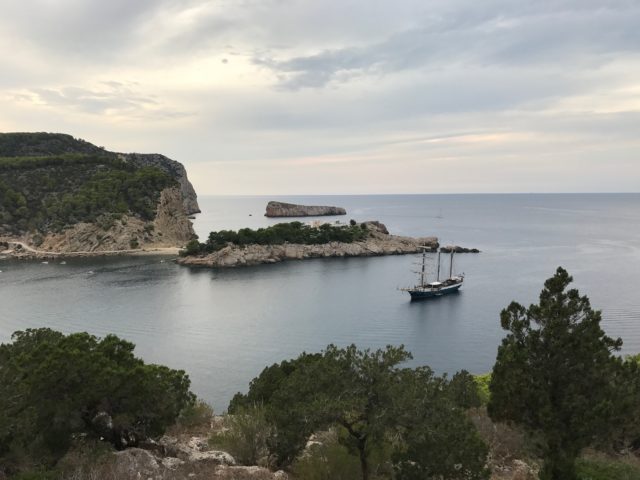 Wide View Of Sail Boat By Cliff Island In Cove