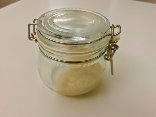 Homemade Lip Scrub With Organic Honey And Sugar And Coconut Oil In A Glass Jar