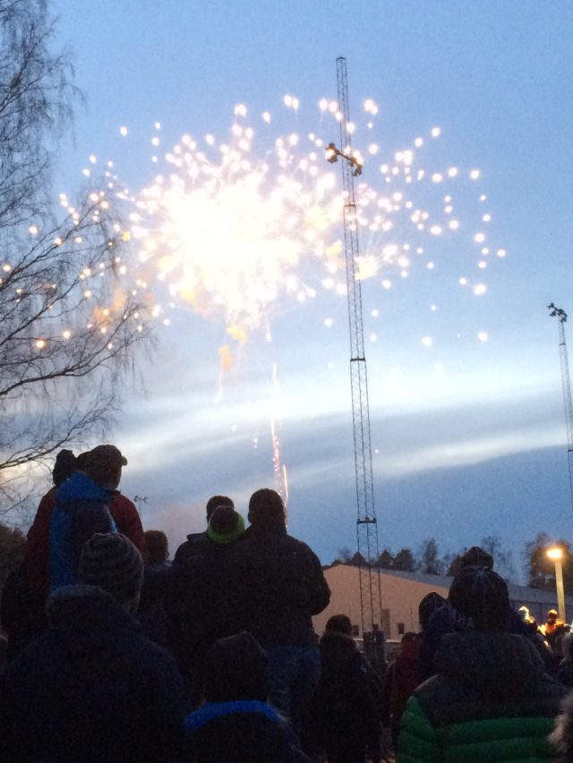 People Standing Outdoors And Watching Fireworks One Spring Evening