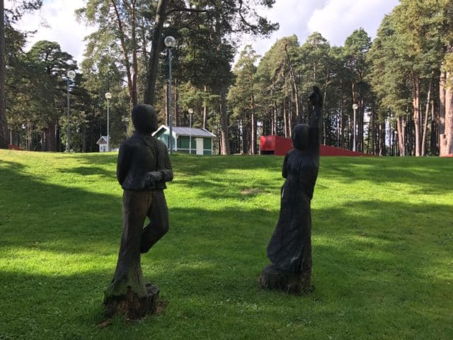 Dancing Wooden Tree Sculptures In A Park
