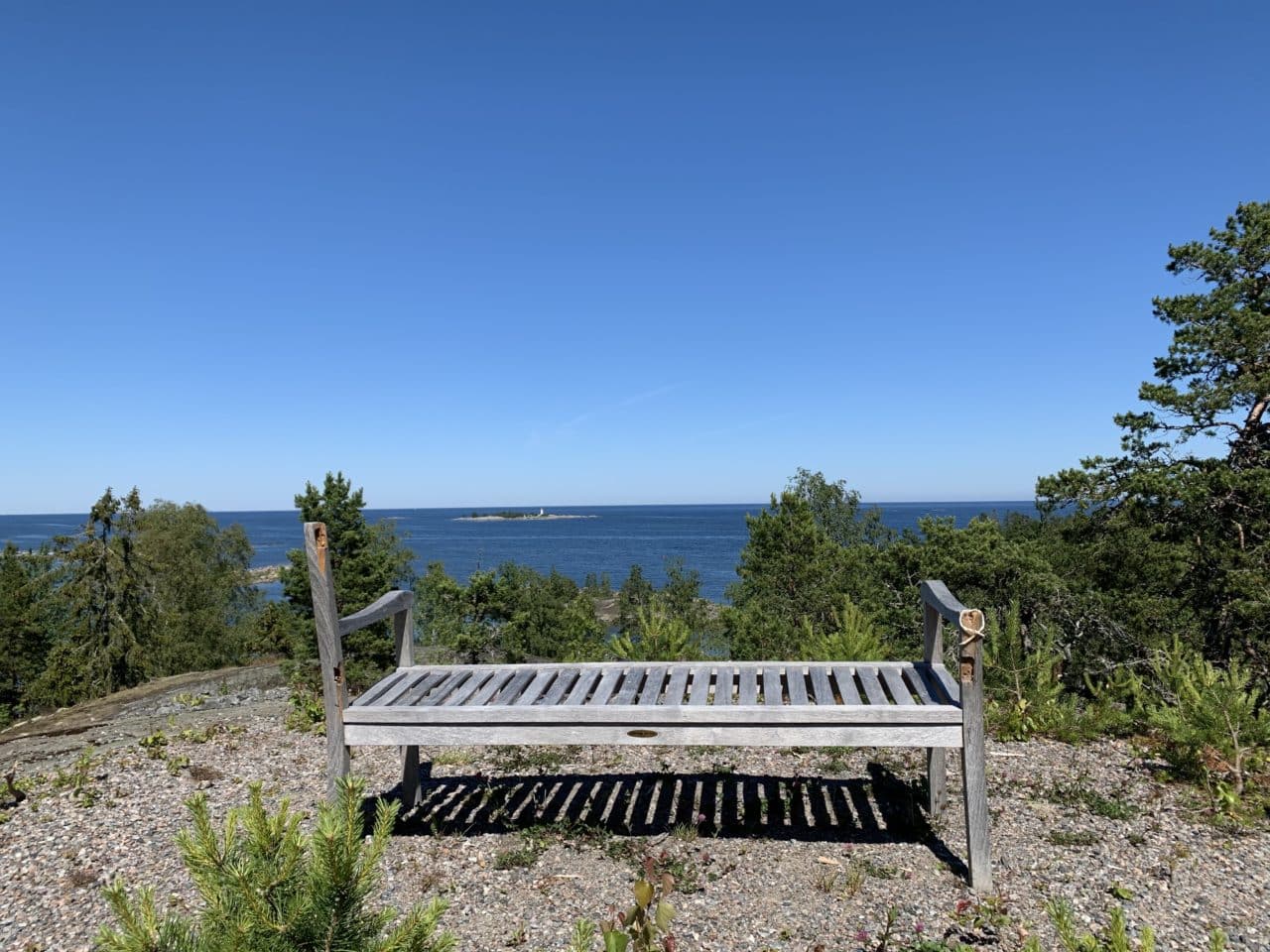 Old Broken Wooden Bench On A Mountain Top With A Ocean View