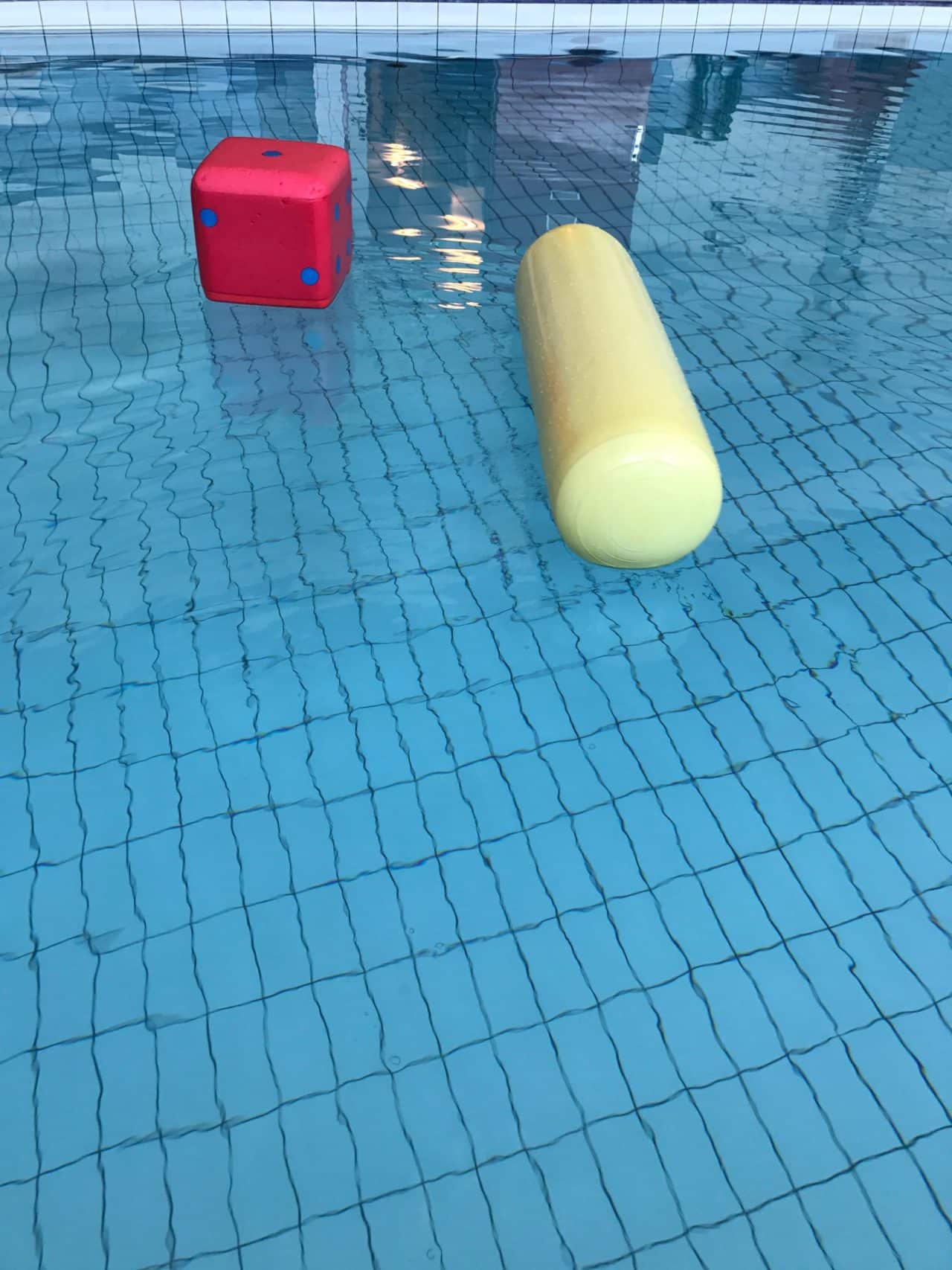 Pool Noodle And Dice In A Pool