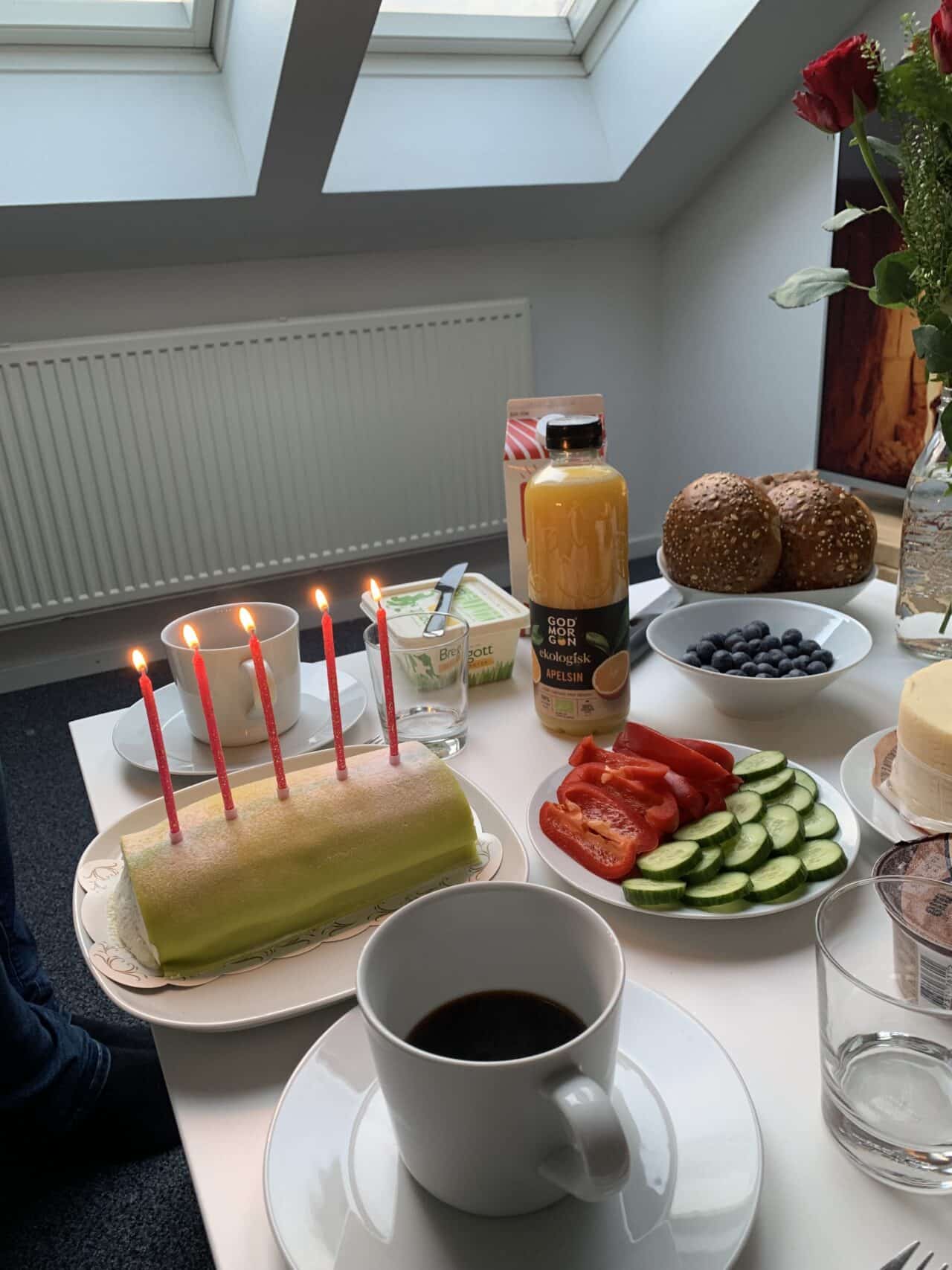 Breakfast Table With Lit Candles On A Marzipan Cake