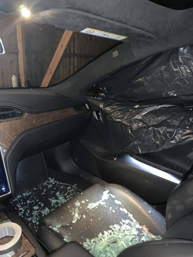 Broken Tesla Window With Glass On Seat And Floor