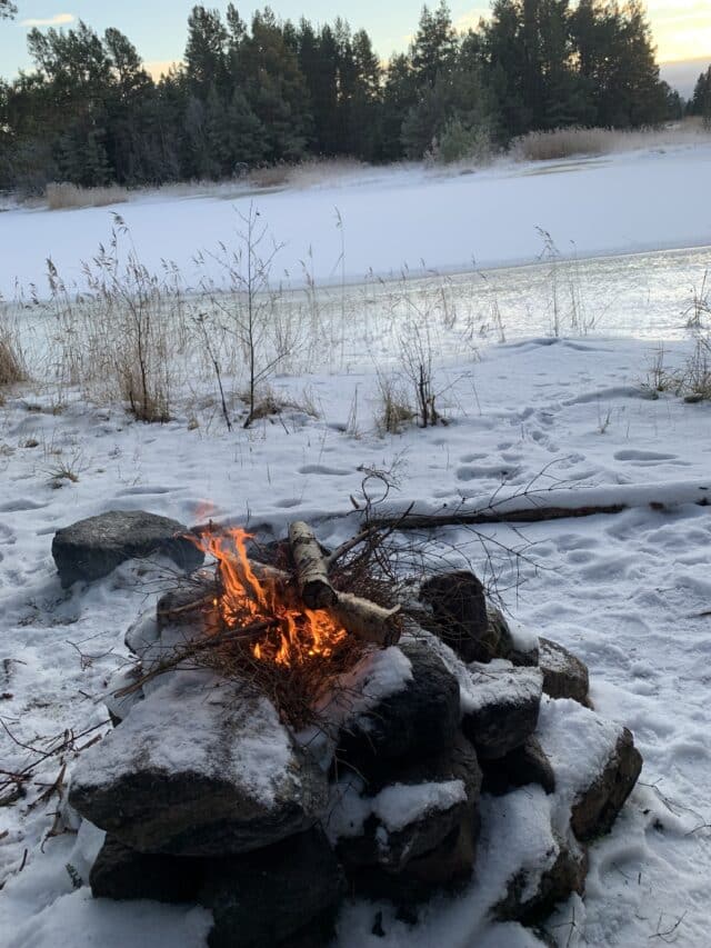 Camp Fireplace By Frozen Ocean In Winter