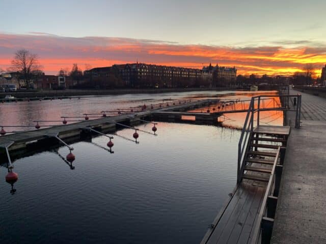 City River Dock At Orange Sunset