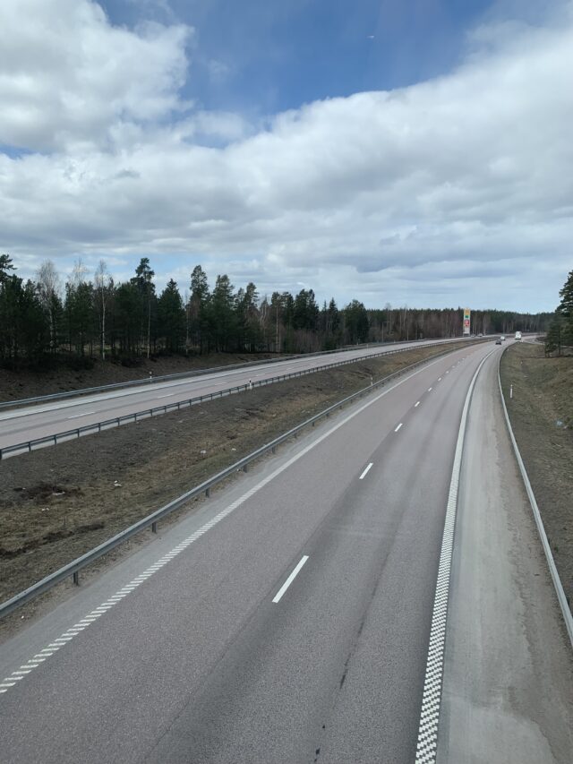 Empty Highway Road With Blue Sky And Clouds