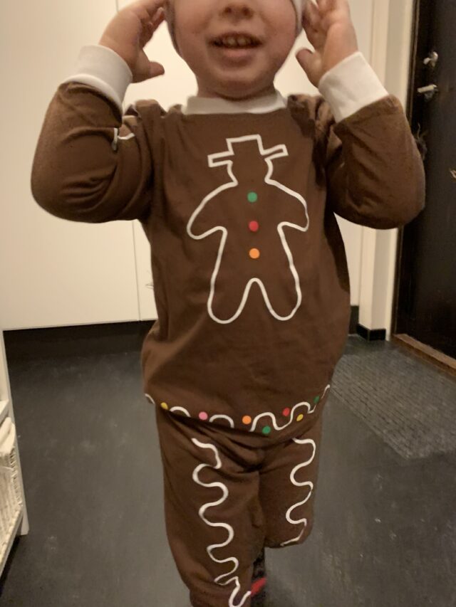 Child Wearing Gingerbread Pyjama Outfit