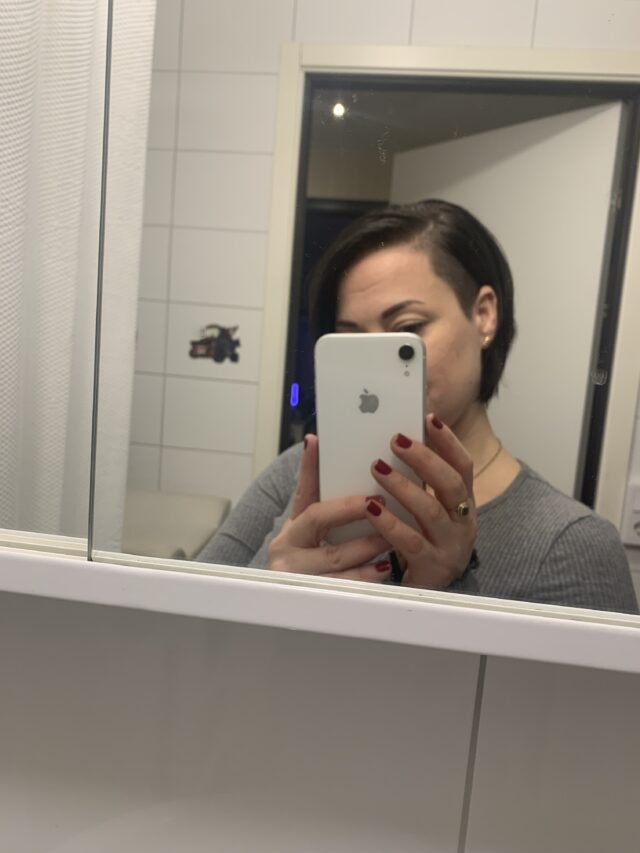 Woman Taking A Selfie In A Mirror