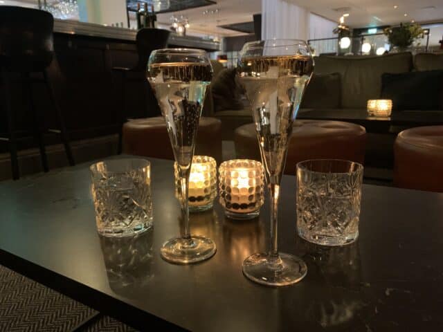 Glasses Of Champagne On Table In Hotel Bar
