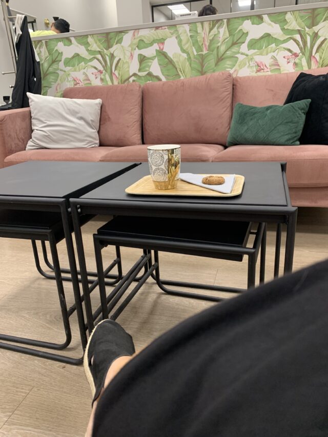 Hair Salon Waiting Lounge With Table And Plate With Coffee And Cookie