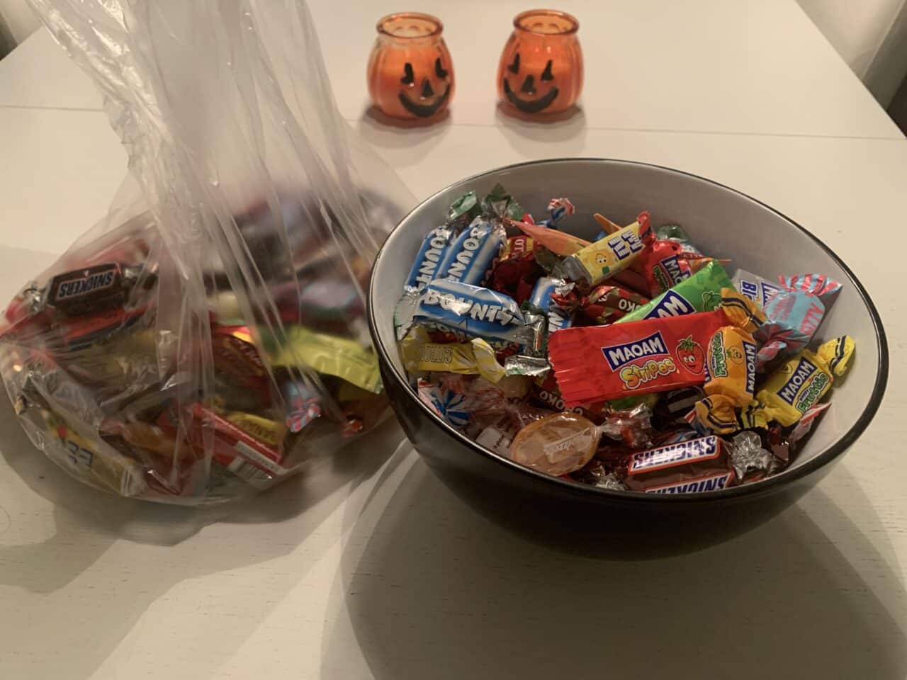Bowl And Plastic Bag Of Wrapped Halloween Candy