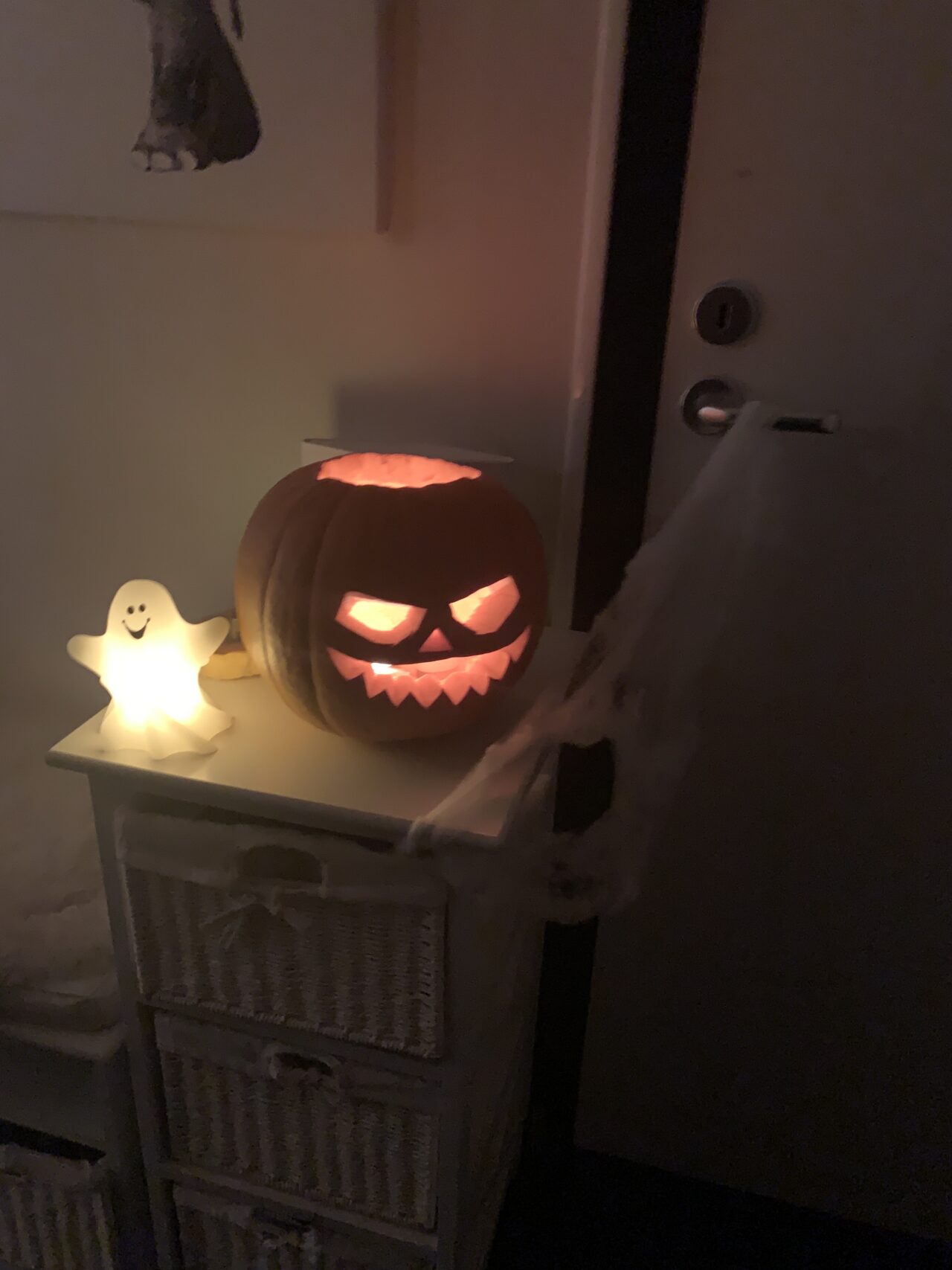 Carved Halloween Pumpkin With Candles And A Ghost