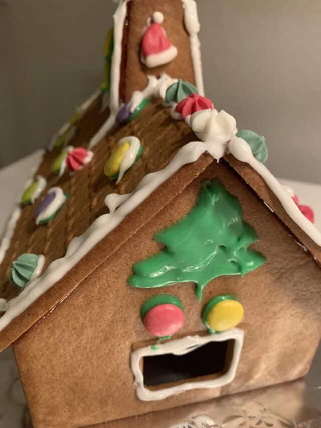 Homemade Gingerbread House With Frosting And Candy Decorations
