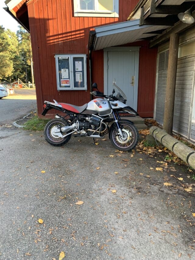 Motorcycle Parked By The Entrance Of A House