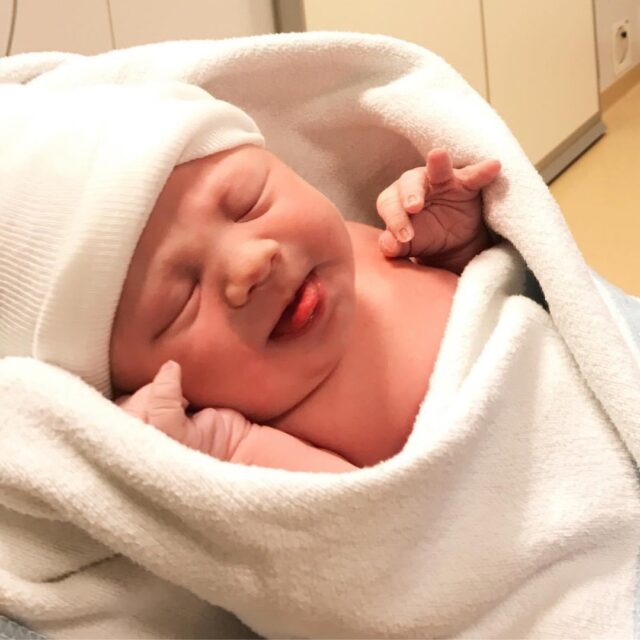 New Born Bay Wrapped In White Blanket