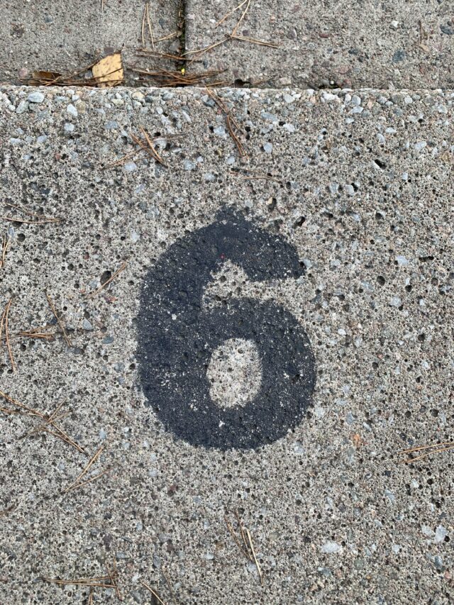 Number 6 Text On Concrete Slab