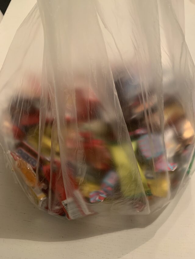 Plastic Bag Of Wrapped Halloween Candy