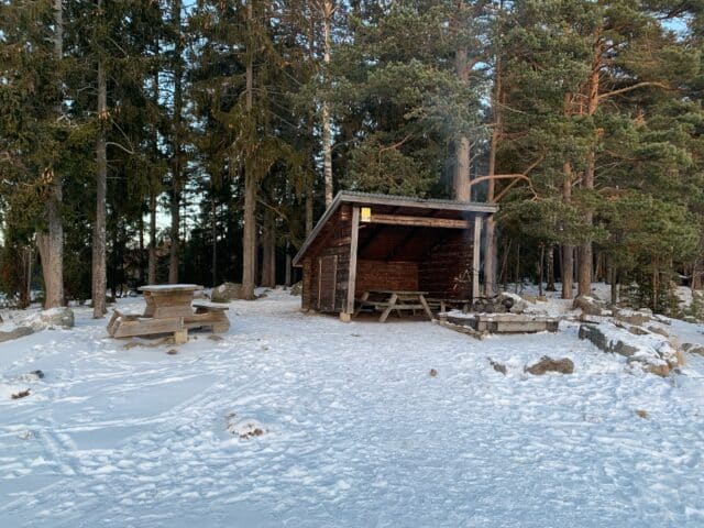 Windbreak With Fireplace In The Forest For Outdoor Activation