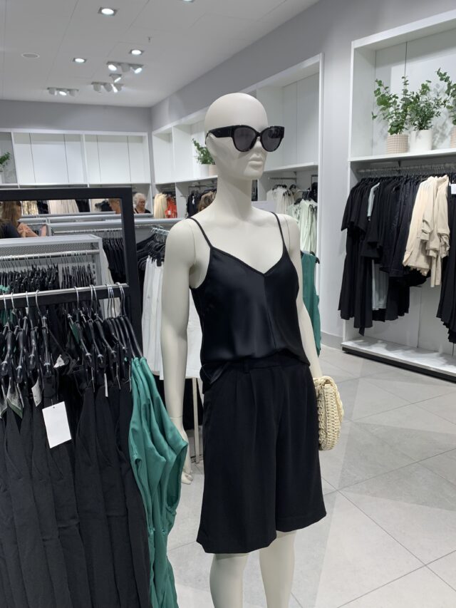 Store Mannequin With Black Glasses And Dress