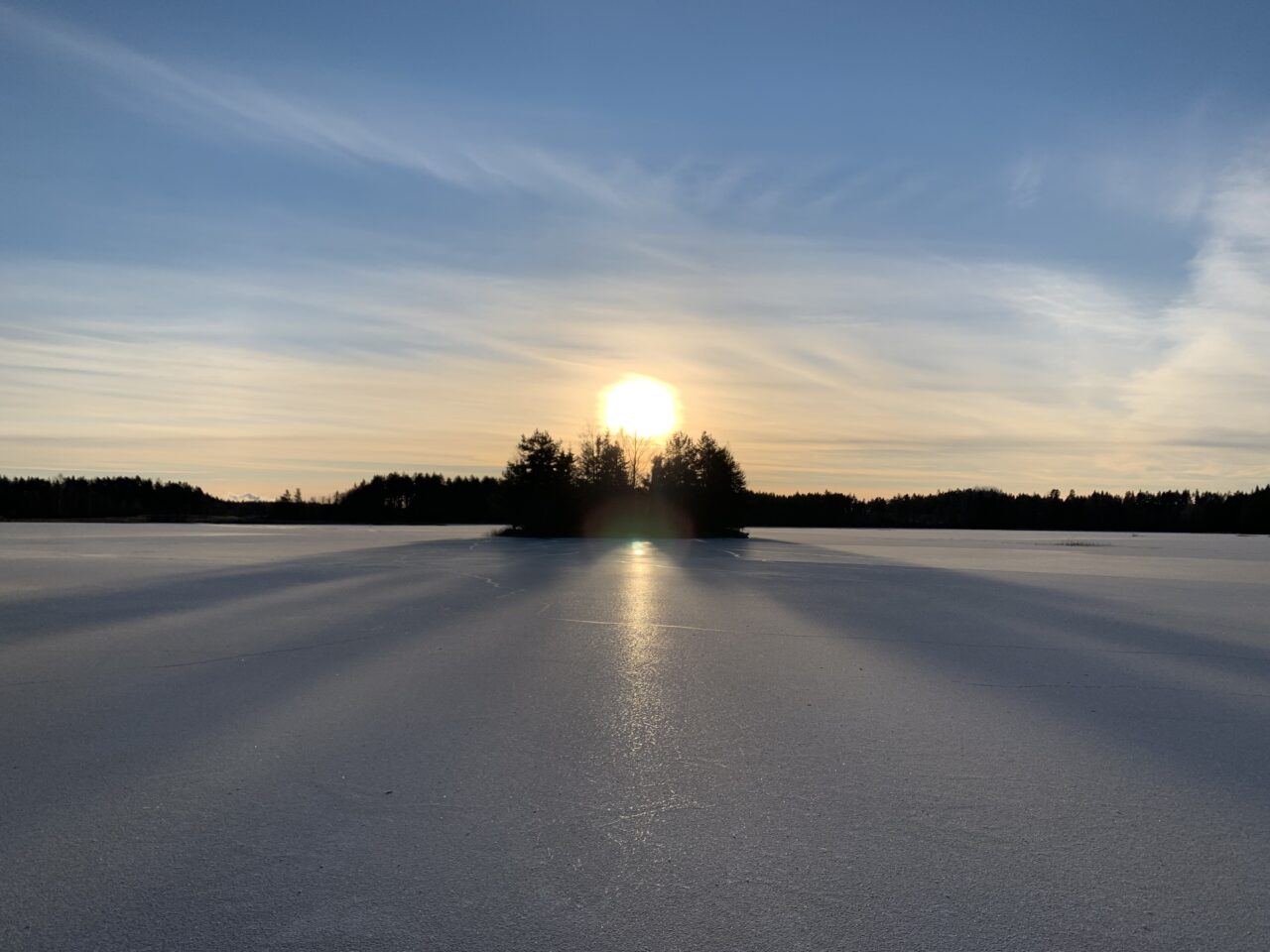 Island In Frozen Lake In Winter With Sun God Rays