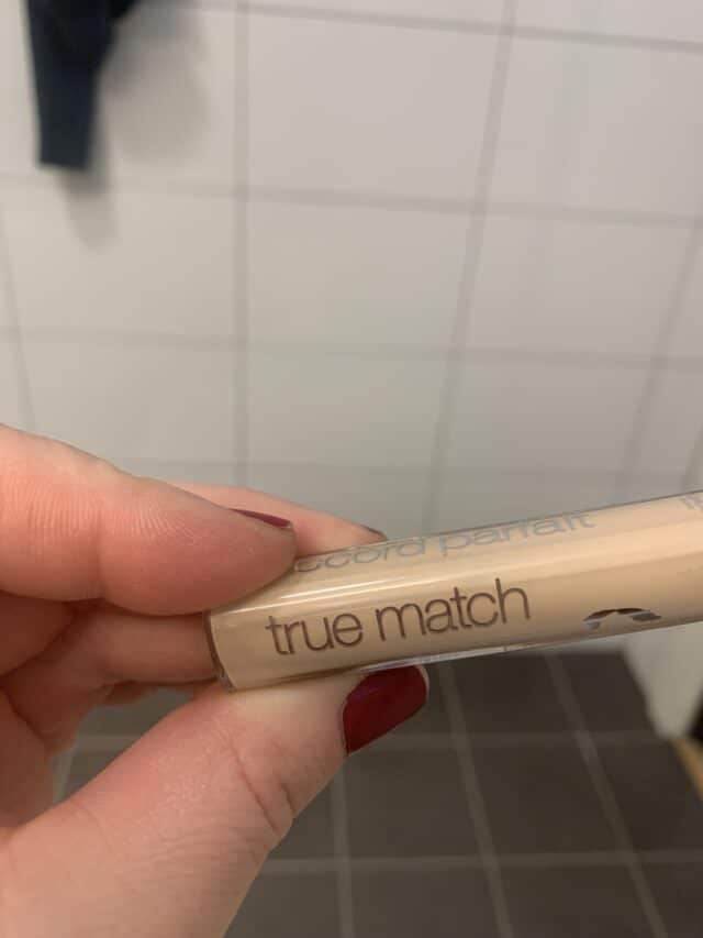 Hand Holding True Match Makeup Bottle