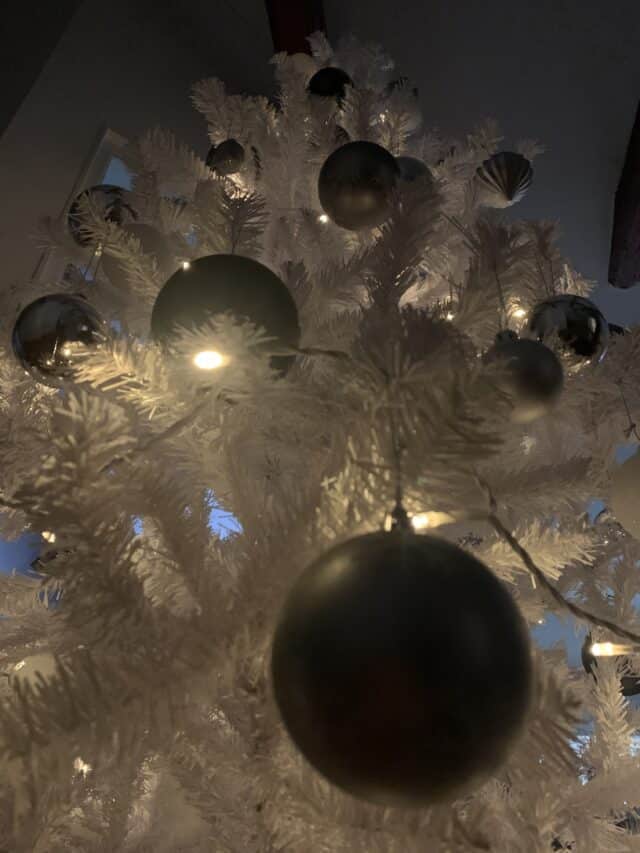 White Christmas Tree With Gray Baubles And Lights