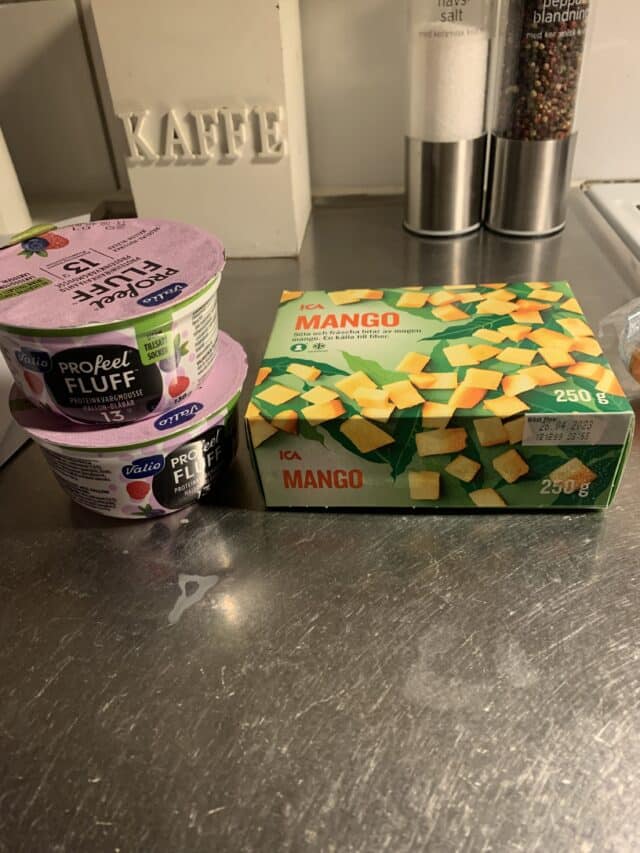 Yoghurt And Frozen Mango For Smoothie In Kitchen